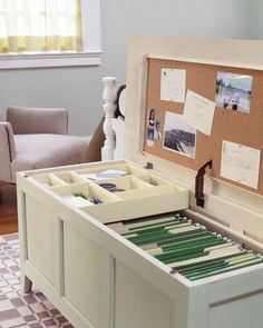 an open drawer with some papers in it