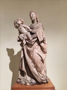 a statue of a woman holding a child