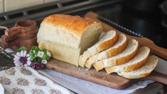 a loaf of bread sitting on top of a cutting board