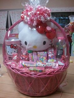 a pink hello kitty gift basket on a table