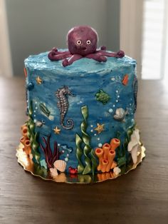 an octopus cake with sea creatures on it