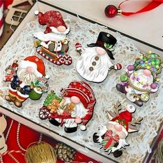 christmas ornaments are on display in a box