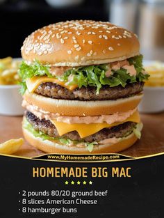 a large hamburger sitting on top of a wooden table