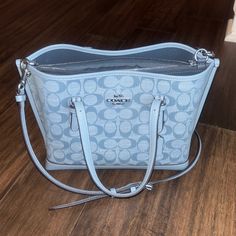 Light Blue, Gently Used. Strap Included. Dimensions: 9.5” Length 7.75” Height 5” Width Daily Use Light Blue Coach Bag, Coach Light Blue Shoulder Bag For Everyday Use, Coach Blue Crossbody Bag, Coach Blue Bag With Adjustable Strap, Coach Blue Shoulder Bag With Silver-tone Hardware, Coach Purse, Coach Purses, Coach Bags, Small Bags