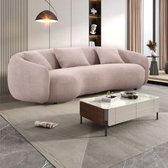 a living room with a pink couch and coffee table