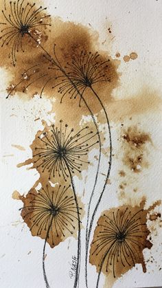 watercolor painting of brown flowers on white paper with black ink splots and stains