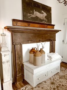 a mantle with two jugs on it in the middle of a living room area