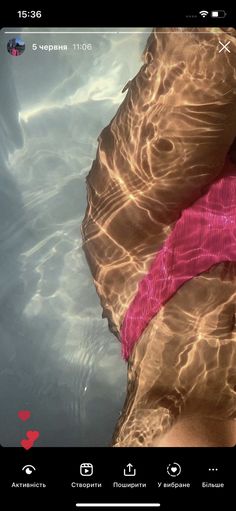 the bottom half of a person's leg in water with sunlight shining on them