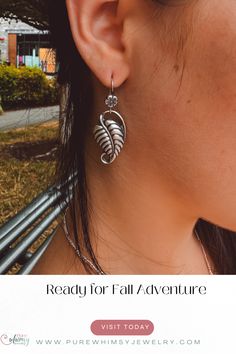 These statement dangle earrings are handmade from fine silver and Argentium sterling silver.  They create a harmonious and earthy aesthetic with the addition of the sweet flower on the ear wire.

Find your whimsy and connection to nature with these artisan leaf earrings. Earthy Aesthetic, Falling Leaves