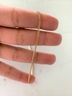 2.2MM 14K Gold SOLID Miami Cuban Link Chain | 14K Gold Curb Link Chain | Layering Gold Chain | SOLID GOLD This beautiful 14K gold necklace can be worn as a choker, as a layering piece or with a set of chains as a layering piece. It will add a statement to your outfit. It can be combined with multiple chains of different lengths to give the messy chains look. It comes available in yellow gold only. ⁙ Materials: 14K Gold⁙ Available colors: Yellow Gold ⁙ Necklace measurements: 16",18", 20", 22", 24 14k Yellow Gold Chain Necklace, 14k Yellow Gold Curb Chain Necklace, Gold 14k Figaro Chain Necklace, 14k Yellow Gold Cuban Link Chain Necklace, 14k Gold Cuban Link Cable Chain Necklace, Gold Cuban Link Chain Necklace In 14k, Gold Curb Chain Necklace In 14k Gold, 14k Gold Necklace With Curb Chain, Yellow Gold Delicate Chain Cuban Link Necklace