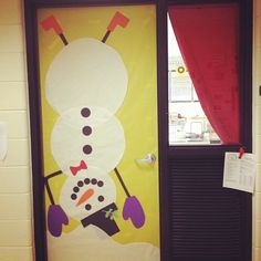 a door decorated to look like a snowman