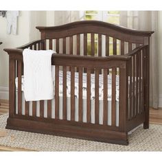 a baby crib in a room with white walls