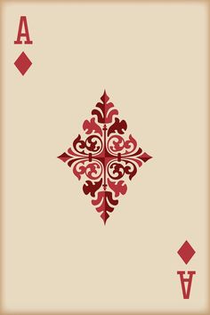 the back side of a playing card with red and brown designs on it, in front of