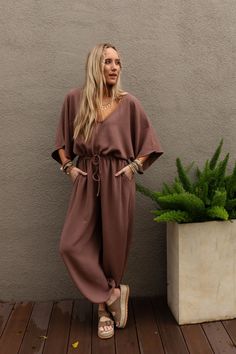 Excited to bring you the New Love Relaxed Drawstring Jumpsuit from our exclusive collection; The Nest by Three Bird Nest. Check out the rest of the collection here - Inspired by you, created by us. You'll get so many compliments in this one - piece because it features: Lightweight, slightly textured fabric Relaxed and loose jumpsuit silhouette Flattering v - neckline and open back detail with self - tie support strap Loose and wide kimono style sleeves Elastic, gathered, drawstring center waistb Drawstring Jumpsuit, Boho Essentials, Bralette Outfit, Three Bird Nest, Loose Jumpsuit, Comfy Pants, The Nest, Kimono Style, Bird Nest