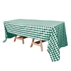 a green and white checkered tablecloth with wooden legs