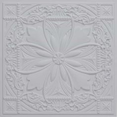 an intricately designed ceiling tile in white