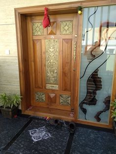 a wooden door with decorative glass panels on it