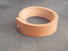 This beautiful leather bracelet was made using high quality leather and will wear wonderfully with age. The leather cuff is provided with a strong silvery rivet, for a quick and easy closure.Guidelines : ● wide: 1.7 cm (0.7")● long: 17 cm (6.7") long (from a snap to another) -> It would best fit a 15 cm (6") wrist. ● thick: 3 mmIt will definitely add a sweet touch to your outfit! *** It will be packed in a linen bag, hand stamped with a black arrow that would make a pretty keepsake. *** For more Beige Leather Jewelry, Bracelet For Her, Womens Bracelet, Black Arrow, Bracelet Leather, Boho Bracelet, Bracelet Boho, Linen Bag, Leather Key