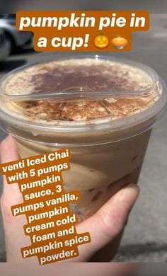 someone holding up a cup with pumpkin pie in it and the words, pumpkin pie in a cup