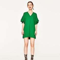 Sold Out At Zara Gorgeous Green Frilled Sleeve Dress From Zara Brand. Short And Flowy With V-Neck And Ruffled Sleeves Never Been Worn. New With Tags Green V-neck Dress With Ruffles, Green V-neck Ruffle Dress For Brunch, Elegant Green V-neck Ruffle Dress, Spring V-neck Dress With Ruffle Sleeves, Casual Green Mini Dress With Flutter Sleeves, Chic Green V-neck Dress, Green Mini-length V-neck Dress, Green V-neck Ruffle Dress, Chic Viscose V-neck Dress With Short Sleeves