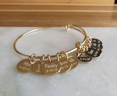 Personalized Adjustable Gold Bangle, Gold Charm Bracelet, Bridesmaid Bracelet, Custom Bracelet Gift, Initial Bracelet, Birthday Gift Ideas ❤️**ABOUT THIS BRACELET** **SEE MEASUREMENTS BELOW** This adjustable personalized bracelet features a shiny and polished gold plated bangle that is beautifully adorned with up to six 14kt gold filled 1/2 inch engraved discs. This is a feminine but sturdy bangle made from heavy 13 gauge metal. There are two double loops that you can gently squeeze together to Gold Charm Bracelet For Bridesmaid Mother's Day Gift, Adjustable Gold Bracelet For Bridesmaid Gift, Adjustable Gold Bracelets For Bridesmaids, Charm Bracelet For Bridesmaid Gift, Adjustable Charm Bracelet For Bridesmaid Gift On Mother's Day, Adjustable Charm Bracelet For Bridesmaids, Adjustable Bangle For Birthday, Adjustable Gold Charm Bracelet Birthday Gift, Adjustable Gold Charm Bracelet For Birthday