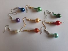 pretty faux pearl and bead earrings a variety of colours and can be on gold or silver tone ear wires ideal gift 5 styles and 9 colours available Colorful Beads Pearl Earrings, Bead Drop Earrings, Beaded Drop Earrings, Wedding Jewelry Earrings, Bead Earrings, Wedding Earrings, Ear Wires, Beaded Earrings, Faux Pearl