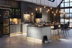 a large kitchen with white cabinets and wood floors