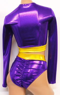 a female mannequin wearing a shiny purple outfit