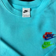 Sky Blue Small Nike Crewneck Multi-Logo Brand New Blue Crew Neck Sweatshirt With Embroidered Logo, Blue Casual Top With Embroidered Logo, Casual Blue Tops With Embroidered Logo, Casual Blue Top With Embroidered Logo, Blue Crew Neck Sweatshirt With Letter Print, Blue Letter Print Sweatshirt For Spring, Nike Blue Cotton Sweatshirt, Nike Blue Sweatshirt For Spring, Blue Tops With Embroidered Logo For Spring