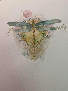 a watercolor drawing of a dragonfly on a piece of paper