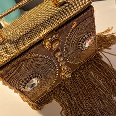 Brand New Bag - Made In India - Statement Piece - Beautiful Gold Fringes And Enlarged Rhinestones Designer Gold Box Bag, Designer Gold Rectangular Box Bag, Designer Gold Clutch With Chain Strap, Luxury Bags With Rhinestone Fringe, Designer Gold Evening Bag With Chain Strap, Designer Embellished Rectangular Shoulder Bag, Elegant Embellished Shoulder Bag, Designer Rectangular Evening Bag With Chain Strap, Designer Gold Clutch With Top Handle