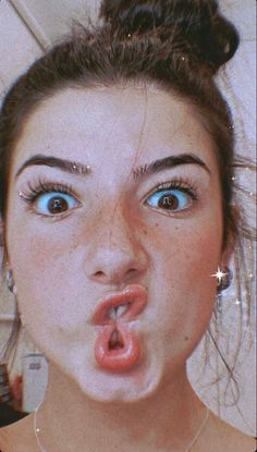 a woman making a funny face with her tongue out