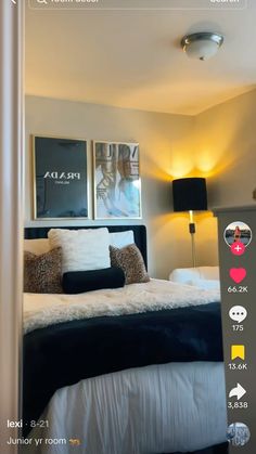 a bed room with a neatly made bed and two pictures on the wall above it