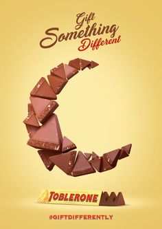 an advertisement for toblerone is shown in the shape of a half - eaten chocolate bar