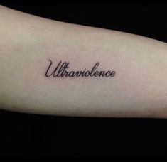 a tattoo with the word unravence written on it's arm and in cursive writing