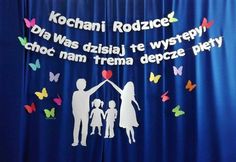 the curtain is decorated with paper cutouts and words that read kochaii rodzics