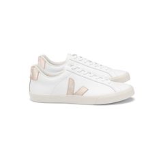 Super sleek and stylish, we can't resist and all white trainer, giving our outfit a fresh look. These Veja Esplar Logo Trainers in Extra White & Platine features:     Made from 100% Leather   Classic tie up trainers  Rose Gold Veja branding on the back  Lined with organic cotton   Rose Gold V logo on the side   Sole made of wild rubber from Amazonian forest  Made in Brazil   Box fresh trainers are straight at the top of our wishlist this season. We will be styling our with a Levete Room blou Veja Trainers Outfit, Classy Trainers, Stockholm Style Shoes, Veja Rose Gold, Veja Gym Shoes, Veja Sneakers V10, Veja Trainers, Veja Esplar, Veja Shoes