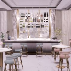 a bar with several stools in front of it and bottles on the wall behind it