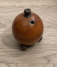 a wooden object sitting on top of a table