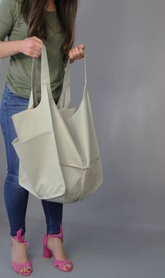 "Leather hobo purse Hobo bag Classic slouchy hobo purse beige leather Soft Natural Leather Large Capacity Every Day Bag Weekender bag Light grey oversized bag - large leather tote bag. Unikque model. Large and stylish tote bag made from high quality leather. Spacious interior provides room for all the daily essentials and more. It is large enough to hold all your weekend essentials. This bag is perfect as your everyday bag, which can fit an IPAD, A4 files, books, magazines, cosmetic bag as well Travel Canvas Hobo Bag With Pockets, Everyday Hobo Bag With Large Capacity, Everyday Large Capacity Hobo Bag, Large Capacity Hobo Bag For Errands, Everyday Large Capacity Softback Hobo Bag, Cream Hobo Bag With Large Capacity For Everyday Use, Leather Hobo Bag With Pockets For Errands, Beige Hobo Bag For Errands, Large Capacity Hobo Bag For Daily Use