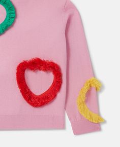 Discover Stella's Pink Fringed Heart Sweatshirt today. Free standard shipping is available on all orders. Shop online now. Pink Crew Neck Sweater With Heart Graphic, Playful Pink Cotton Sweatshirt, Trendy Cotton Sweater With Heart Print, Pink Heart Sweater For Spring, Trendy Pink Sweater With Heart Graphic, Cotton Long Sleeve Sweater With Heart Print, Playful Pink Cotton Sweater, Playful Pink Crew Neck Sweater, Trendy Cotton Sweater With Heart Graphic