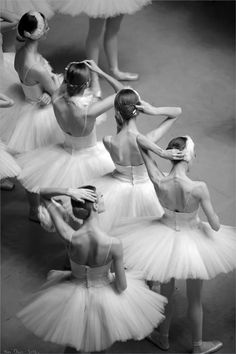 black and white photo of dancers in tutus