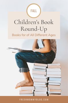 a person sitting on top of a stack of books with the title children's book round - up