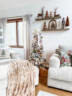 a living room filled with furniture and a christmas tree