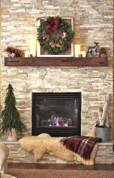 a living room with a fireplace decorated for christmas