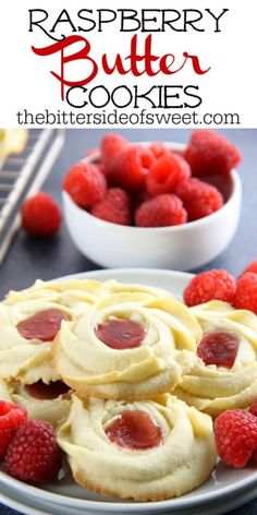 raspberry butter cookies on a plate with fresh raspberries