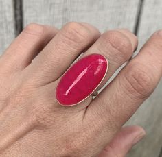 A stunning large oval hot pink dragon agate has been set in sterling silver with a handmade ring band from sterling silver half dome wire. This stone is a bright hot pink color with accenting black veining throughout which gives the stone a look like dragon skin. The stone is 30mm x 15mm in size. Made to order! Choose your stone and size! Hot Pink Rings, Pink Gemstone Ring With Oval Cabochon, Huge Pink Ring, Luxury Pink Oval Cabochon Rings, Sterling Silver Rings Boho, Pink Hand-strung Agate Jewelry, Dragon Skin, Pink Costume, Costume Rings