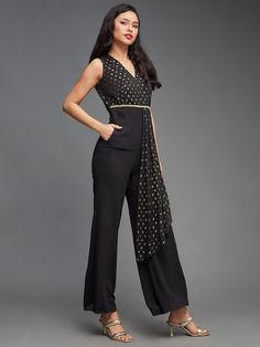 Sizes: To Fit Bust (in inches): XS(30), S(32), M(34), L(36), XL(38) To Fit Waist (in inches): XS(24), S(26), M(28), L(30), XL(32), 2XL(34) Black & gold basic jumpsuit, has a v-neck, sleeveless, 2 pockets Fabric: Polyester Pattern: Floral Printed Style: Jumpsuit Dress For Women, Indian Dress, Indo-Western Dress, Fusion Outfits Occasion: Party Dispatch within 7 days. Indo Western Dress Party Wear, Fusion Outfits, Indo Western Outfits For Women, Ethnic Kurti, Anarkali Lehenga, Style Jumpsuit, Jumpsuit For Women, Indo Western Dress, Western Dress