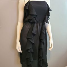 Black Sheer Ruffle Front And Back Dress. Will Need A Slip Inder This. Brand New With Store Tag But Appears Vintage, But Never Worn. Excellent Condition. Knee-length Ruffle Mini Dress, Casual Ruffled Midi Dress For Cocktail, Casual Cocktail Midi Dress With Ruffles, Ruffled Midi Dress For Cocktail, Semi-formal Midi Dress With Ruffles For Cocktail, Flowy Midi-length Ruffle Dress For Party, Black Ruffle Dress, Back Dress, Black Ruffle