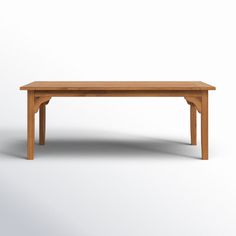 a wooden table on a white background with no one around it or the table is empty